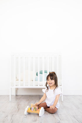 Pearhead Montessori toy fosters hand-eye coordination through pounding play.