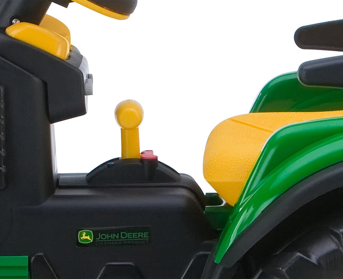 Peg Perego John Deere Ground Loader high-traction wheels handle grass, dirt, gravel, and pavement.