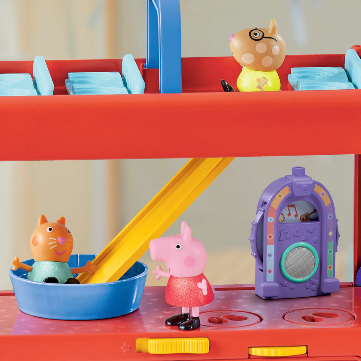 Dance platform twirling feature on Peppa Pig set inspires rhythmic movement play.
