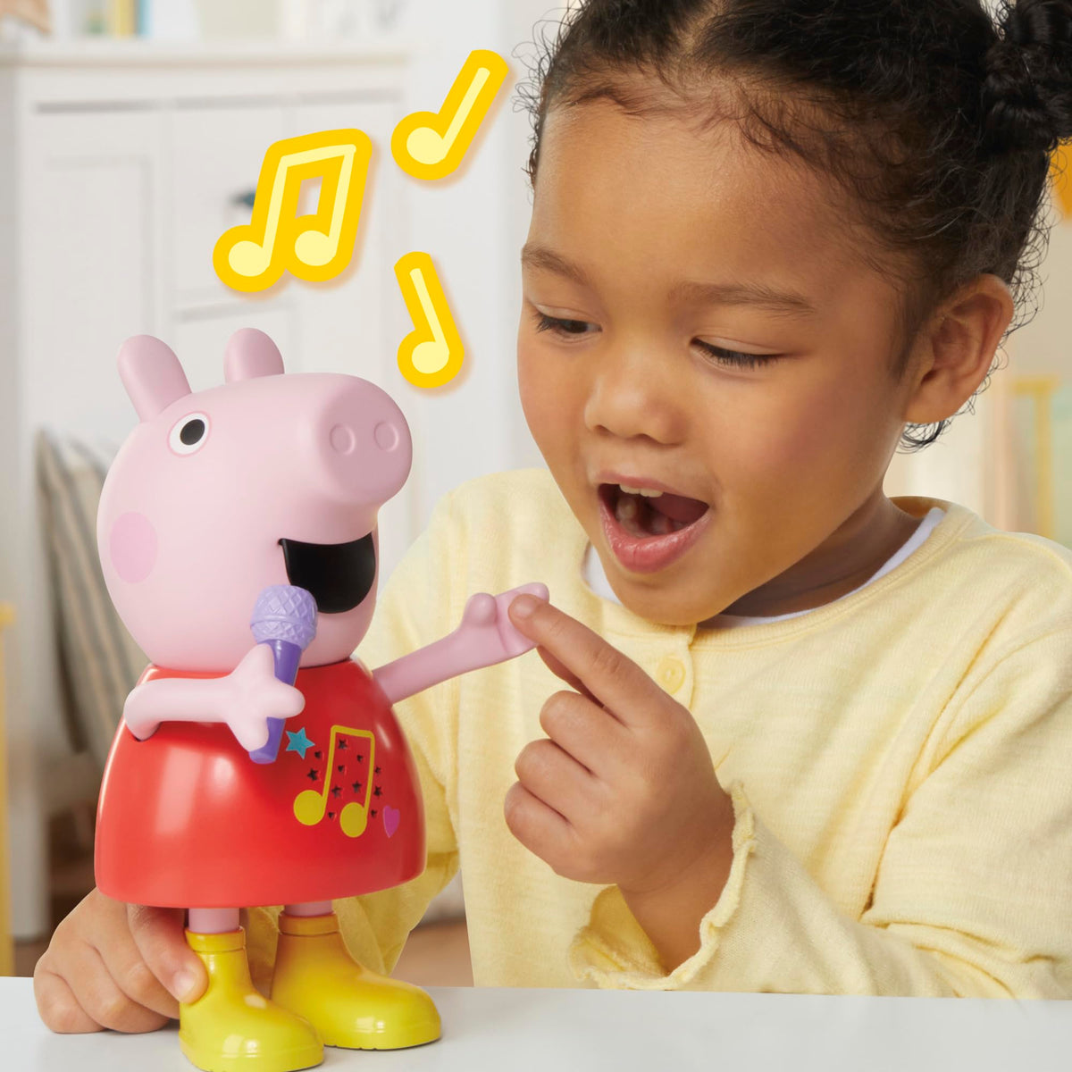 Peppa Pig Talk & Sing Peppa Doll arm movement triggers mouth motion for dialogue.