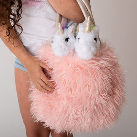 Oversized pink plush carrier bag for the unicorn set.
