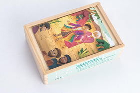 Peyo Pals child playing with wooden puzzles.