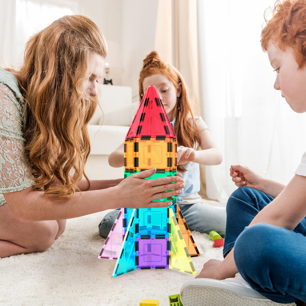 PicassoTiles magnetic building blocks assembly fosters collaborative play and problem-solving.