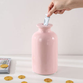 PIG WORLD ceramic piggy bank with break-open design for satisfying savings.