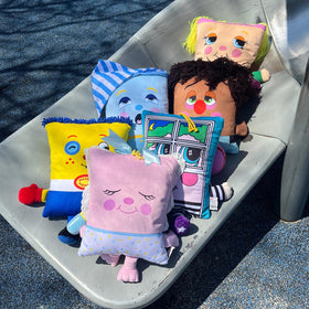 Pillow People PJ Sandman plush side view highlighting soft fabric and comforting shape.