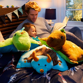 Pillow Pets dinosaur pillow acts as a travel companion on a road trip.