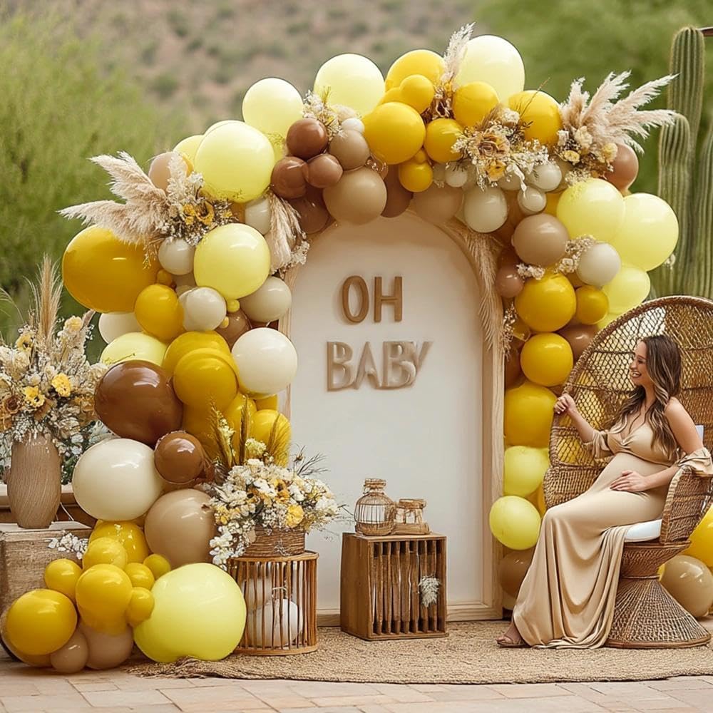 Pinbra double-stuffed yellow-brown balloons add fullness for a striking arch.