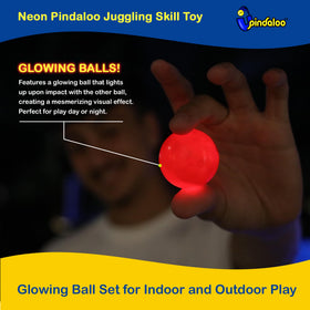 Two balls juggling with neon glow improving hand-eye coordination.