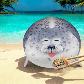 Pineapple Seal Plush on bed enhances bedtime coziness.