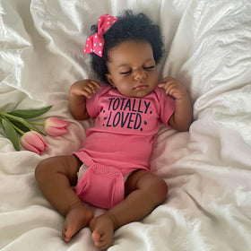 Pinky Reborn 20-inch baby doll face close-up highlighting lifelike features for imaginative play