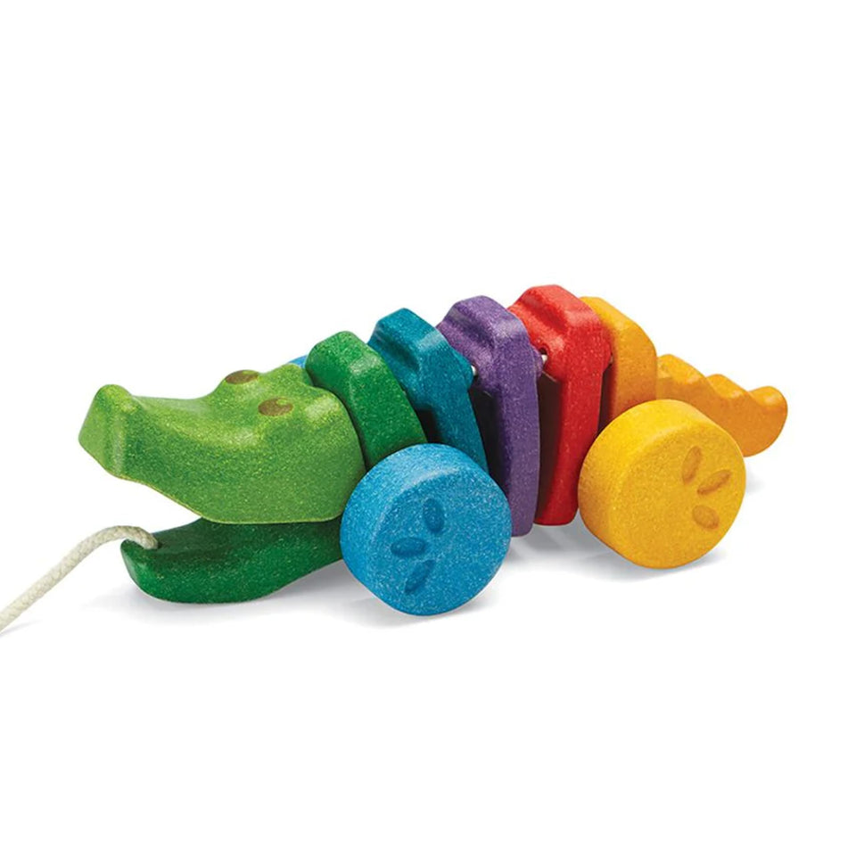 PlanToys Rainbow Dancing Alligator pull toy engages toddlers in movement