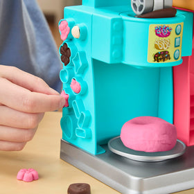 Play-Doh Donut Drop Shop pretend drink cup supports cafe role-play fun.