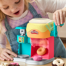 Play-Doh Donut Drop Shop icing machine adds colorful swirls for decor.