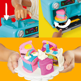 Child creates with Play-Doh in a pretend kitchen.
