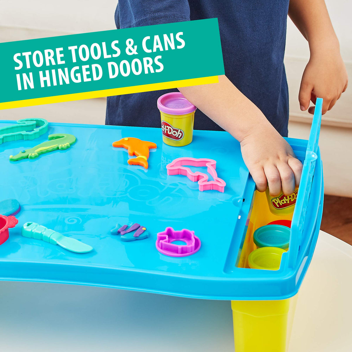 Play-Doh table side storage compartments keeping tools organized.