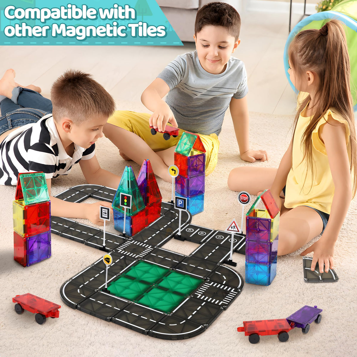 Child assembles a bridge-tunnel with Playmags road tiles