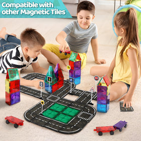 Child assembles a bridge-tunnel with Playmags road tiles
