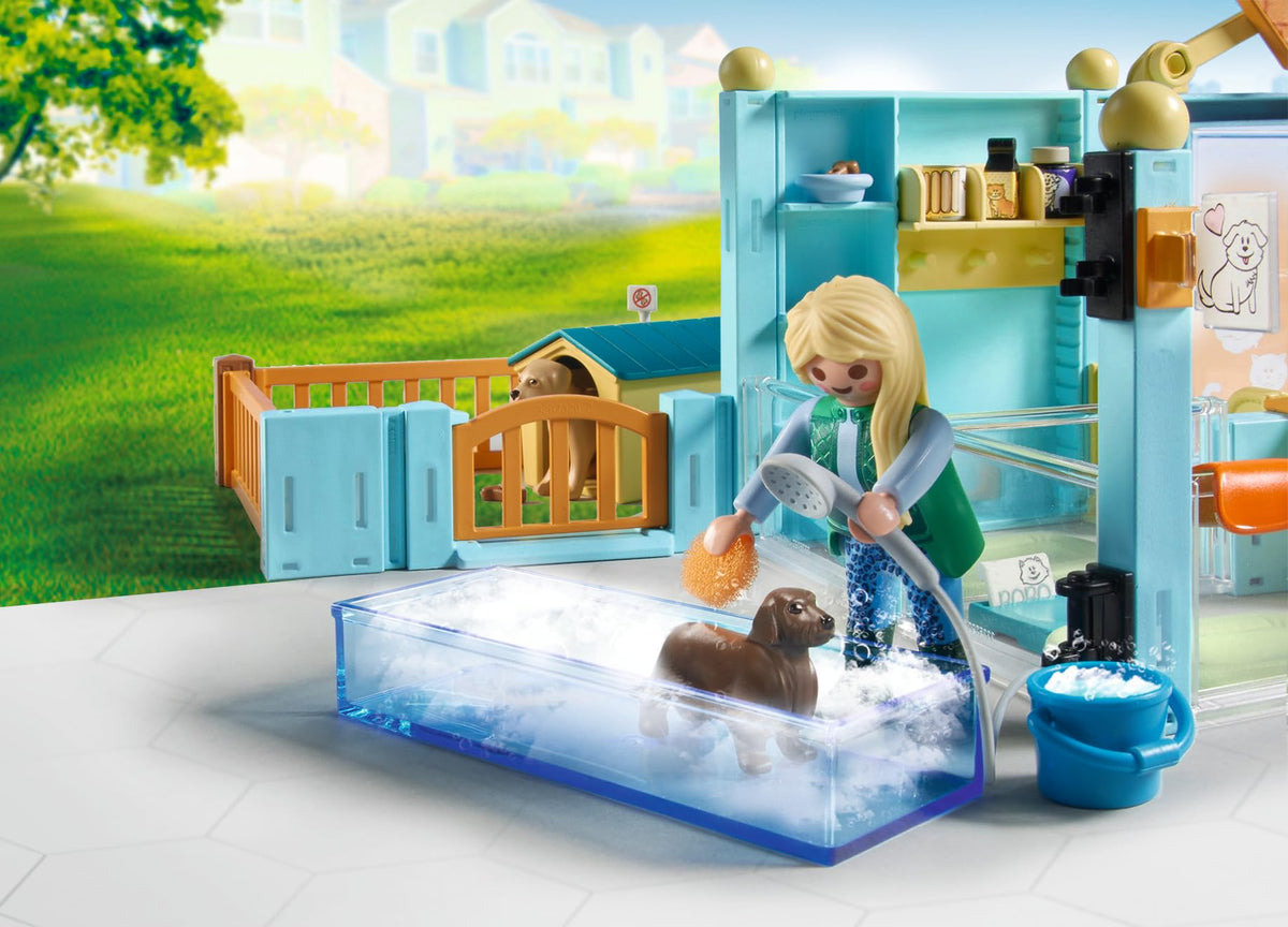 Playmobil Animal Hotel dogs in outdoor pen enjoying supervised playtime outdoors.