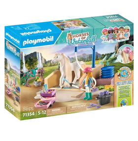 Playmobil Isabella brushing Lioness mane for caring horse play