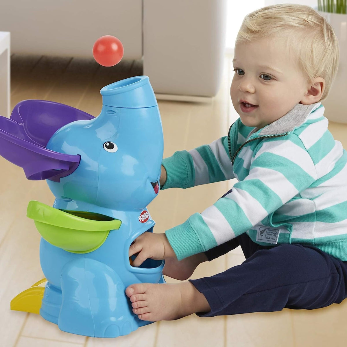 PlayMonster Elefun Busy Ball Popper trunk adjust feature enabling versatile play.