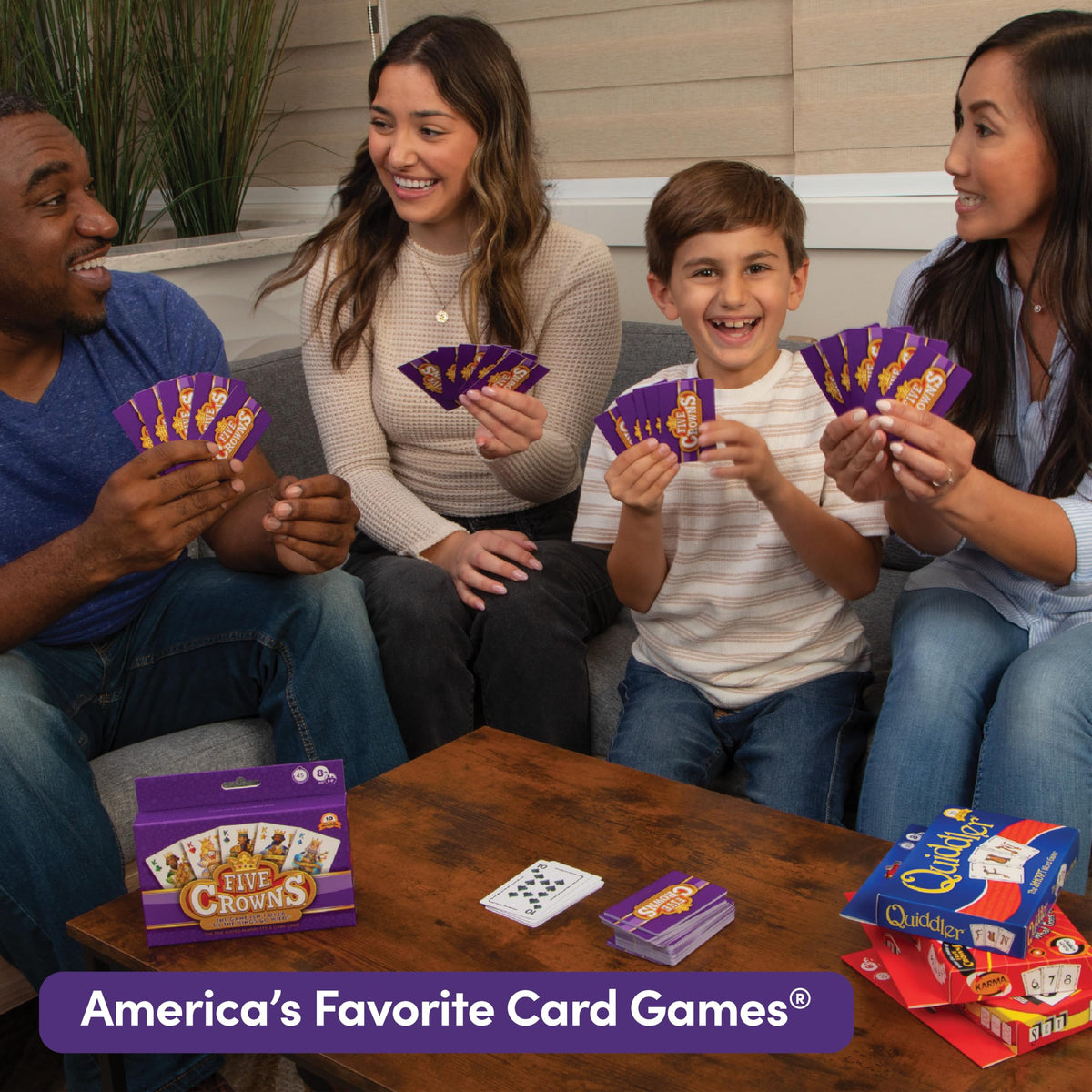PlayMonster family game night bundle shown during a cozy evening