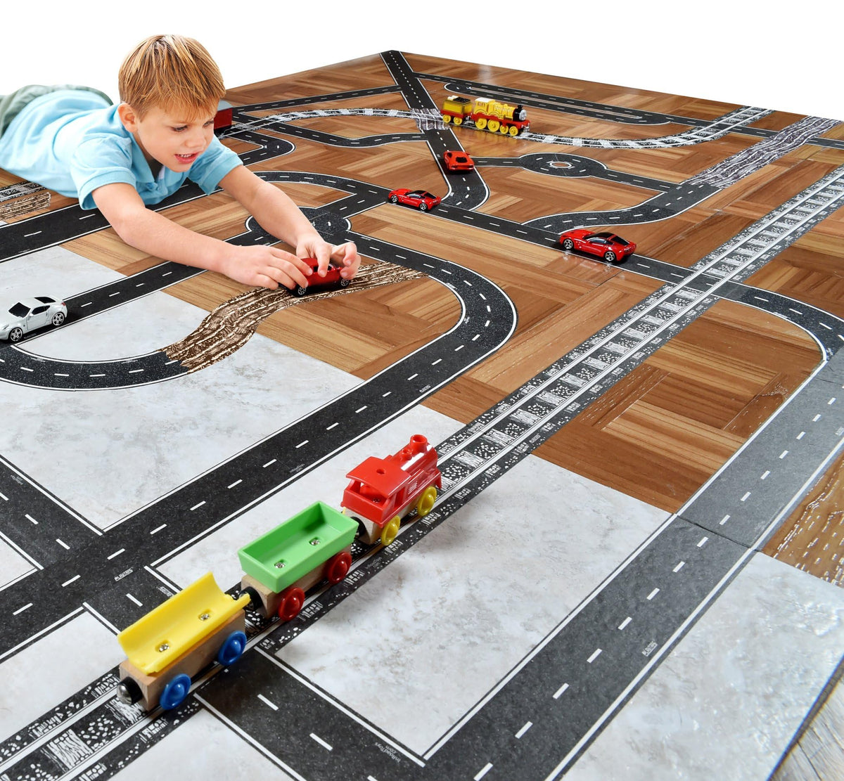 Children easily tear and apply PlayTape to set up roads fast.