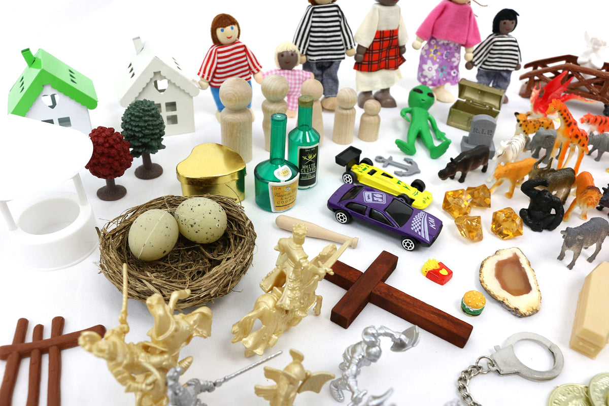 PlayTherapySupply sandtray bridge and wishing well pieces inspire narrative progression.