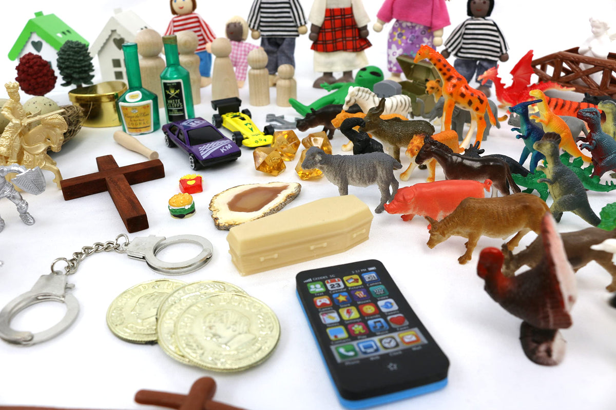 PlayTherapySupply sandtray miniatures varied items image highlights diverse symbolic figures for scenes.