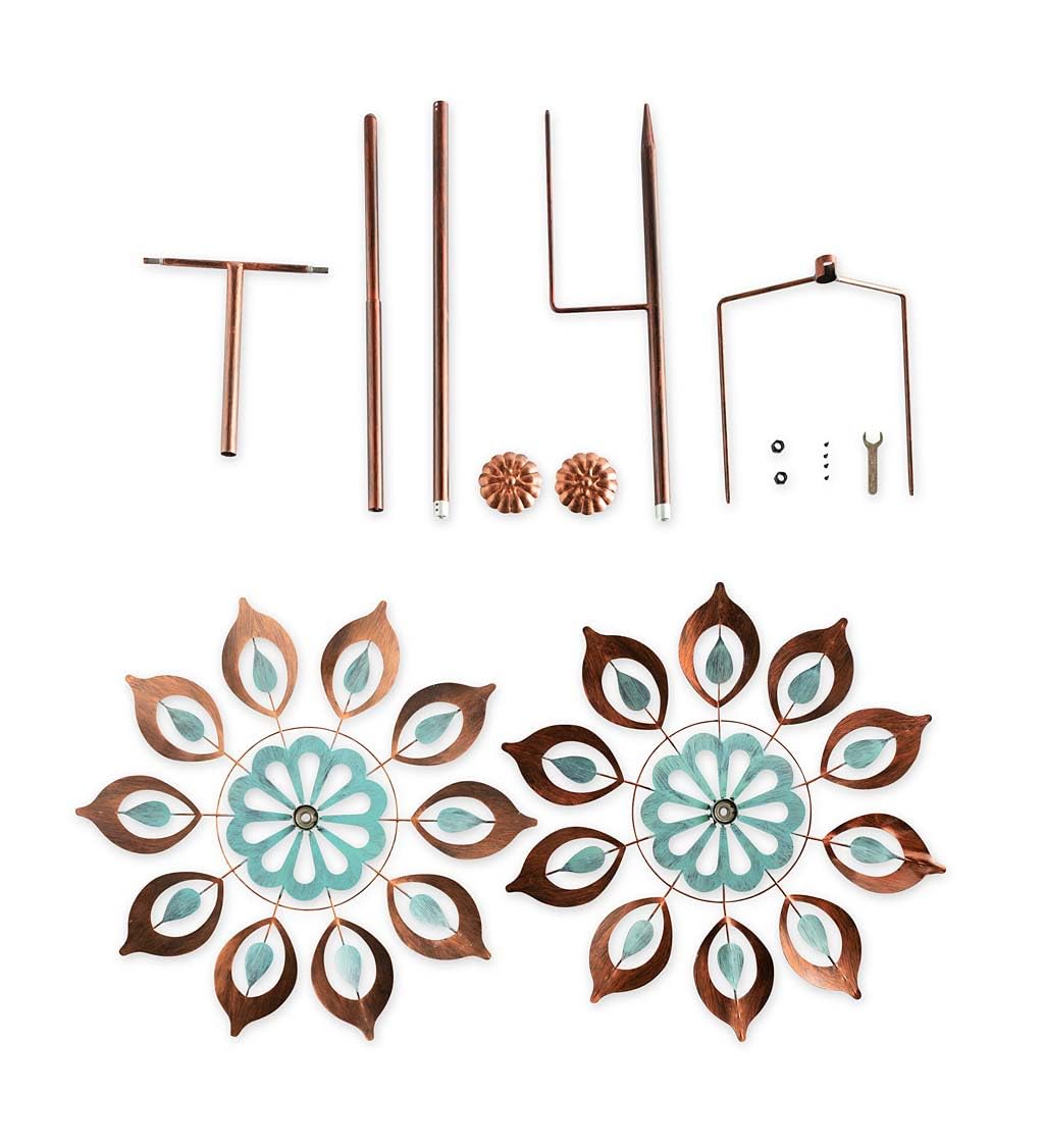 Plow & Hearth Copper Lily Wind Spinner with dual independent rotors in motion