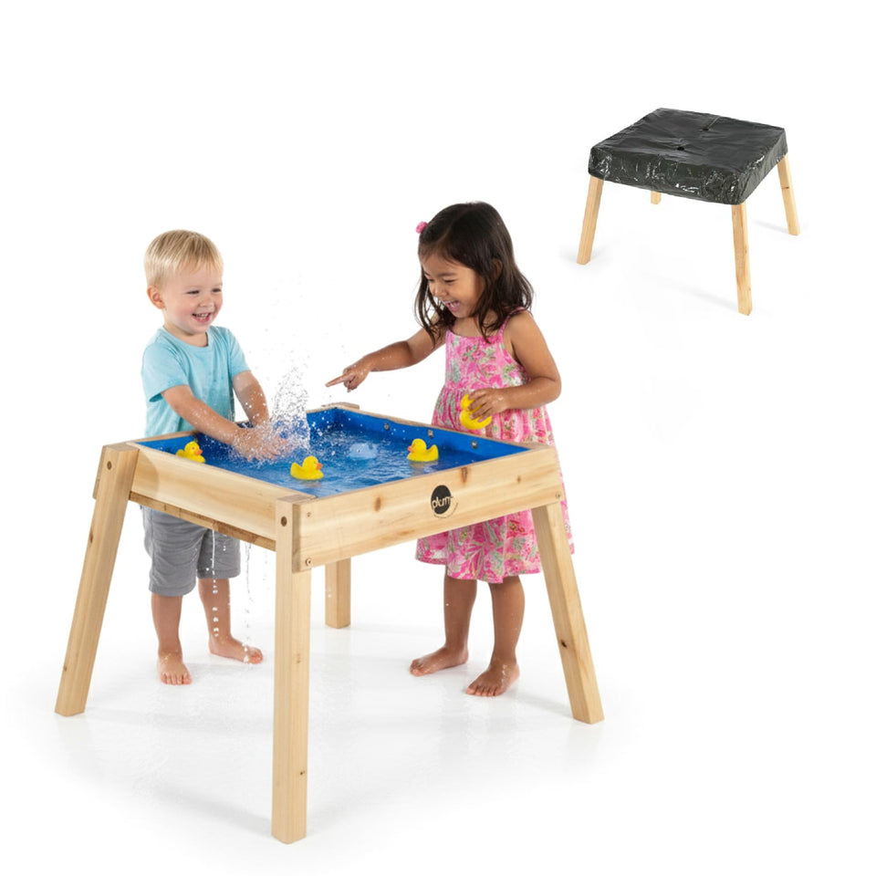 Plum wooden sand and water table in outdoor play setting, durable and kid-friendly.