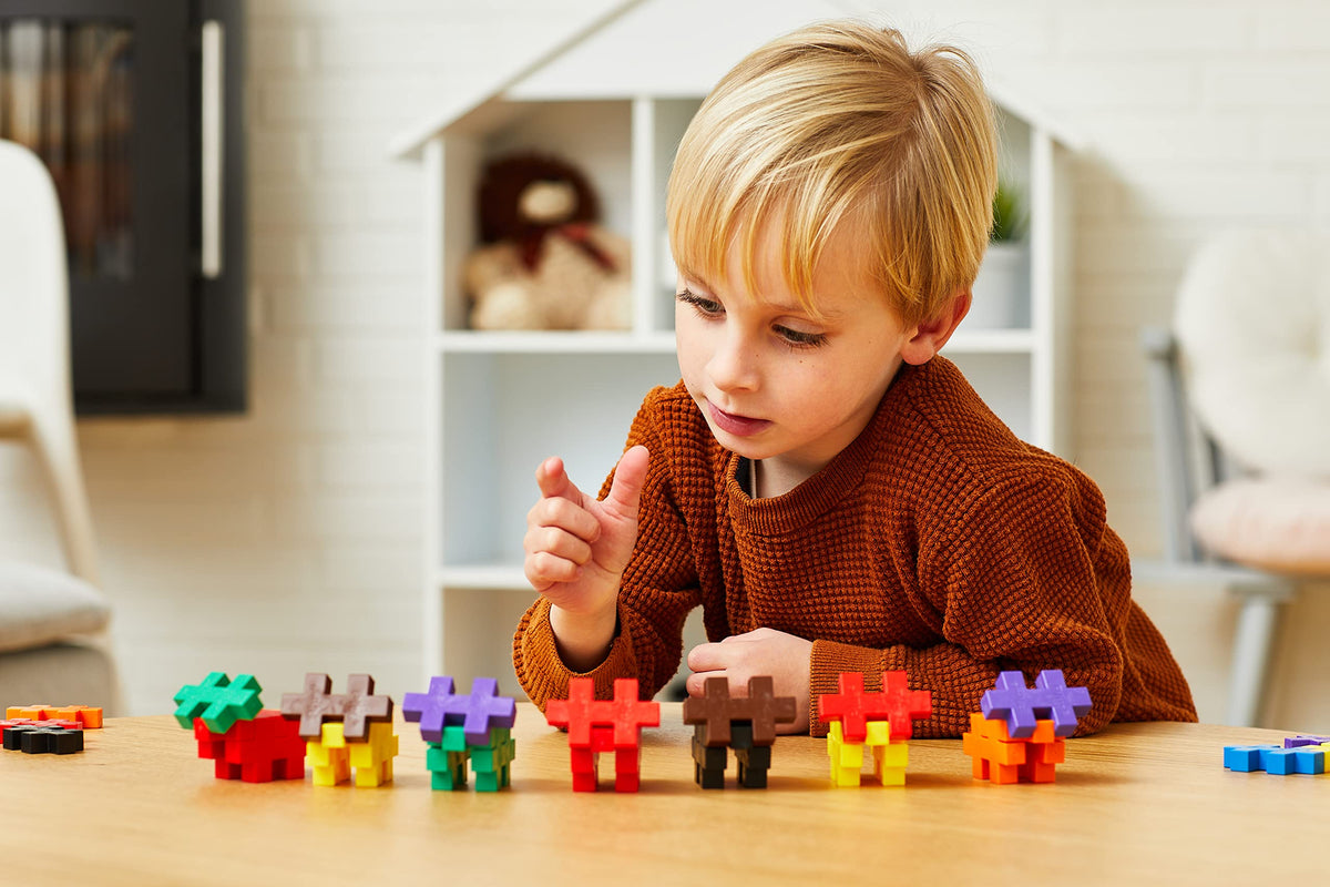 Plus Plus Big 100-piece blocks in action during a family building session.