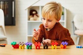 Plus Plus Big 100-piece blocks in action during a family building session.