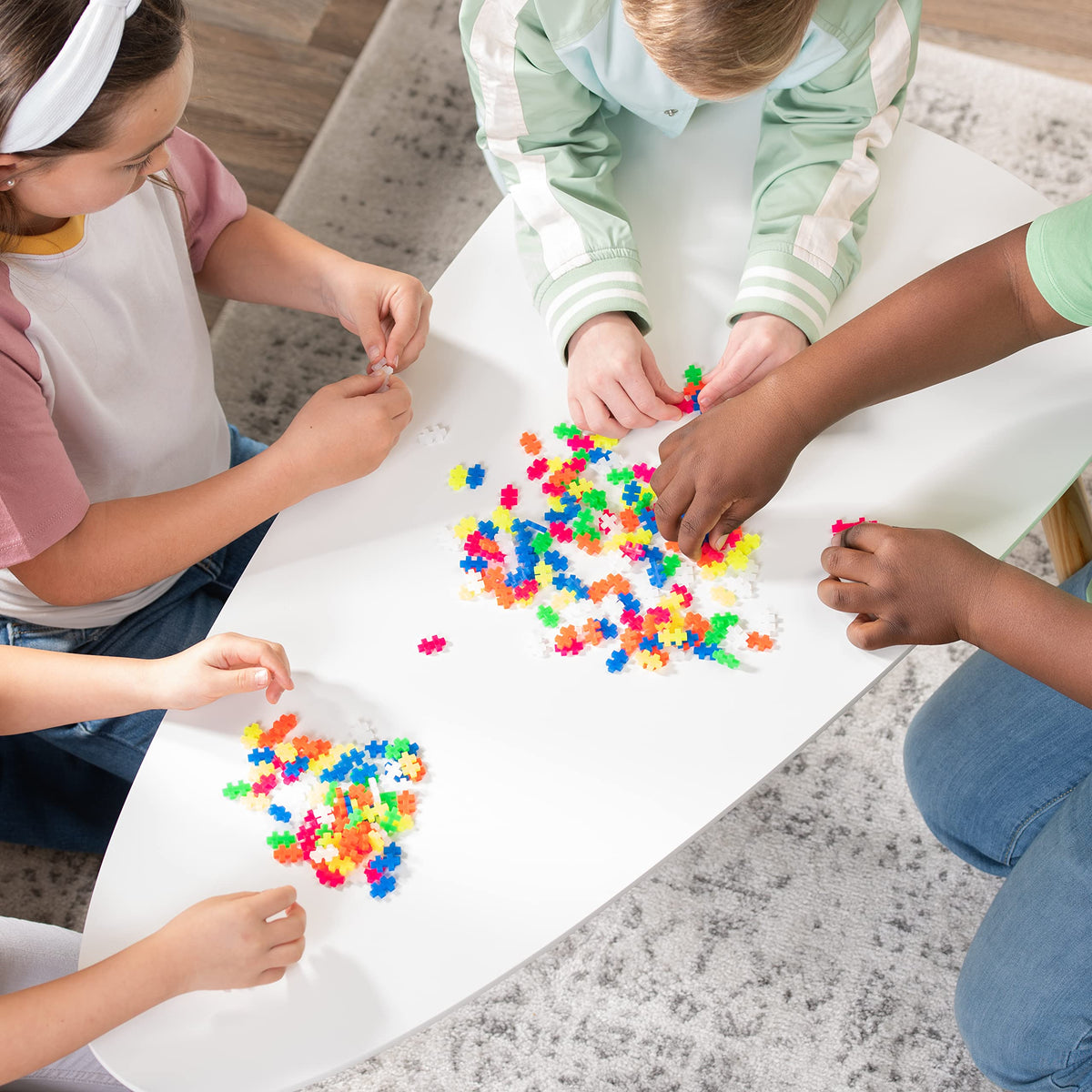 Plus Plus neon bricks for flat mosaics and vibrant 2D designs.