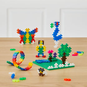 PLUS PLUS neon pieces add vibrant color to 3D constructions.