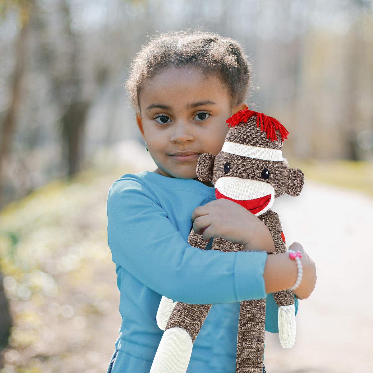 Plushland Sock Monkey serves as a travel companion for kids