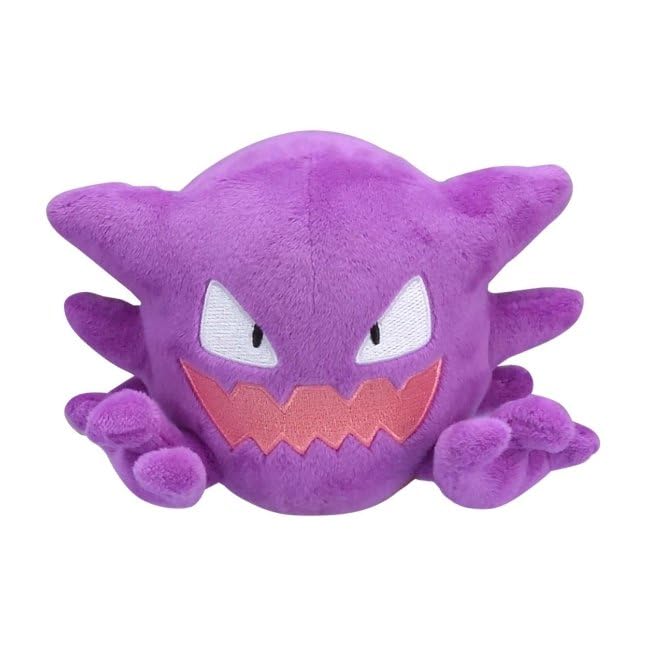 Pokémon Center Haunter Sitting Cuties plush sits upright on a desk for display.
