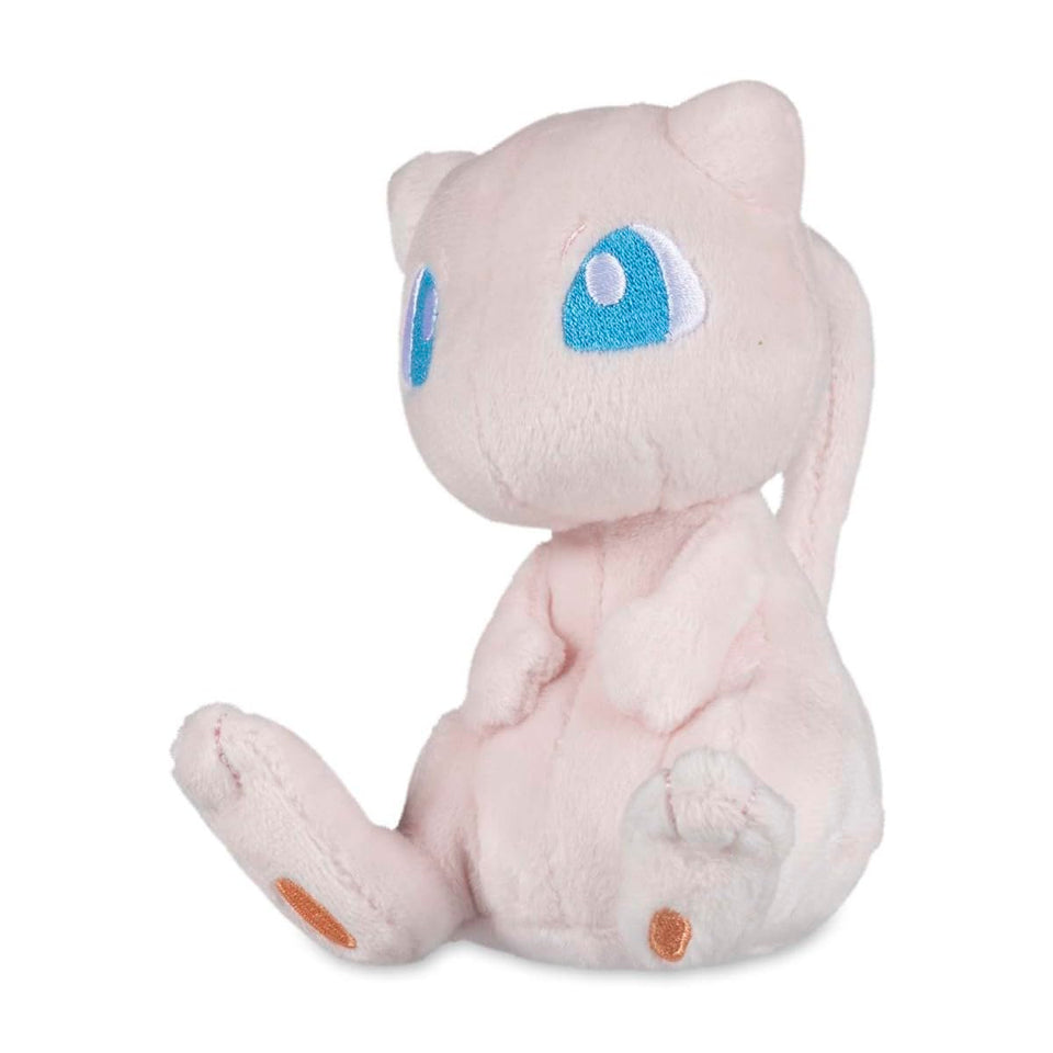 Pokémon Center Mew Sitting Cuties Plush with weighted microbeads sits upright on a desk