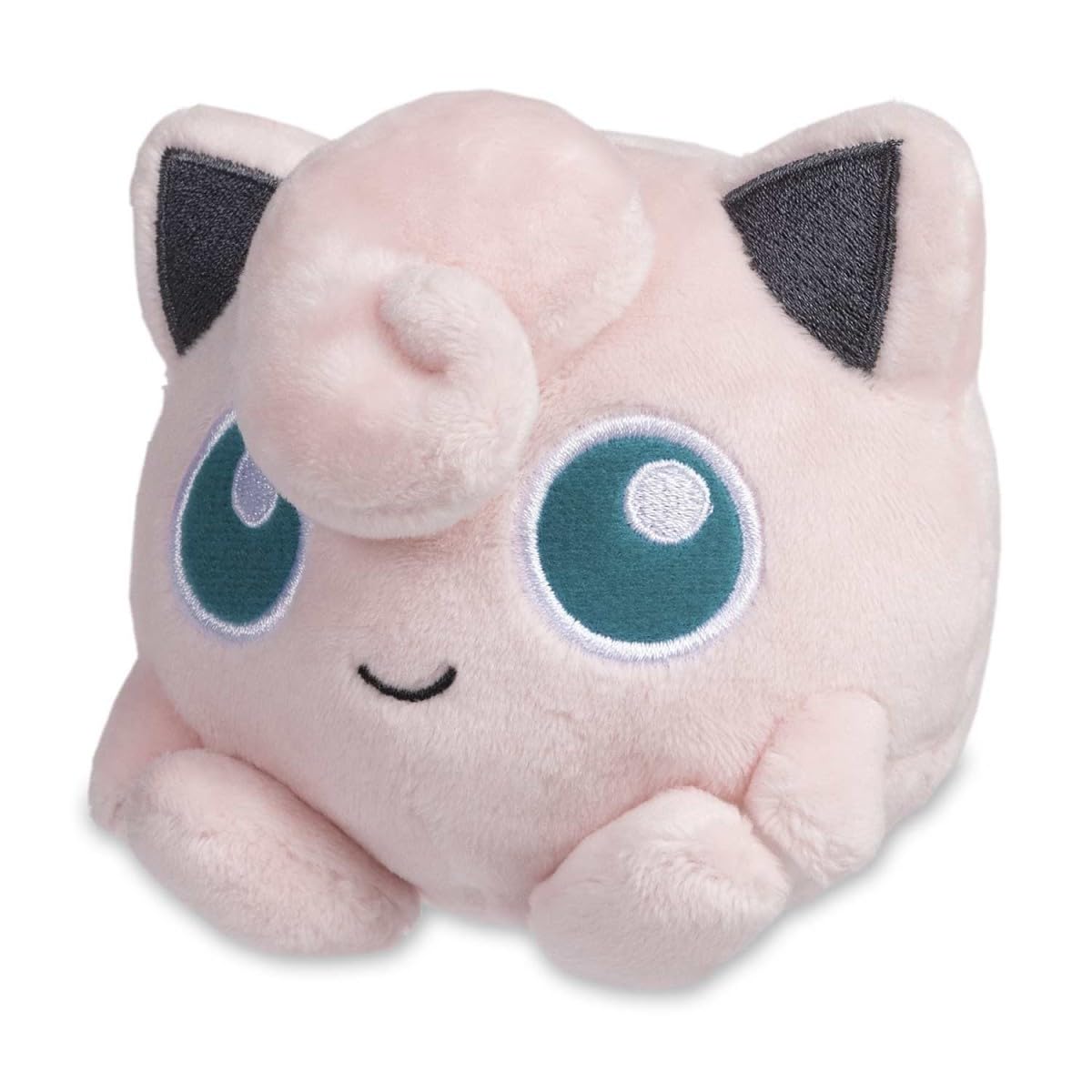 Pokémon Center Jigglypuff Plush sits upright on a surface for desk display