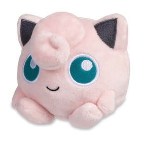 Pokémon Center Jigglypuff Plush sits upright on a surface for desk display