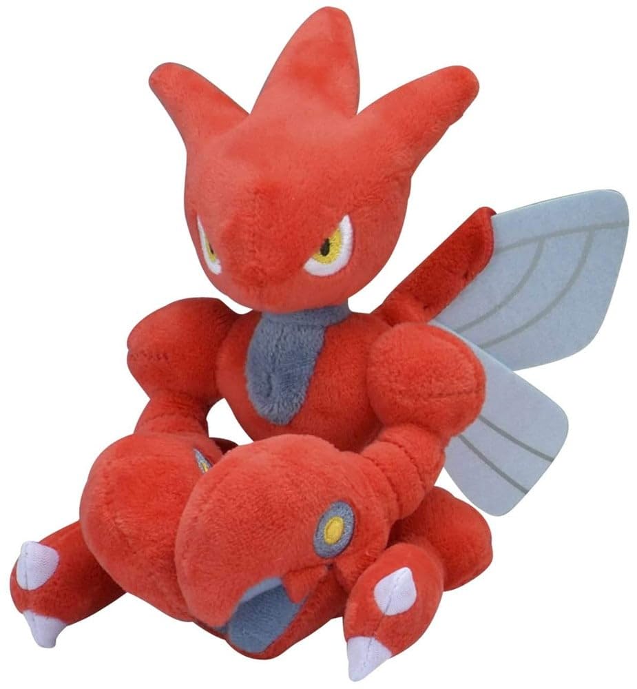 Pokémon Center Scizor Plush sits upright on a desk for display.
