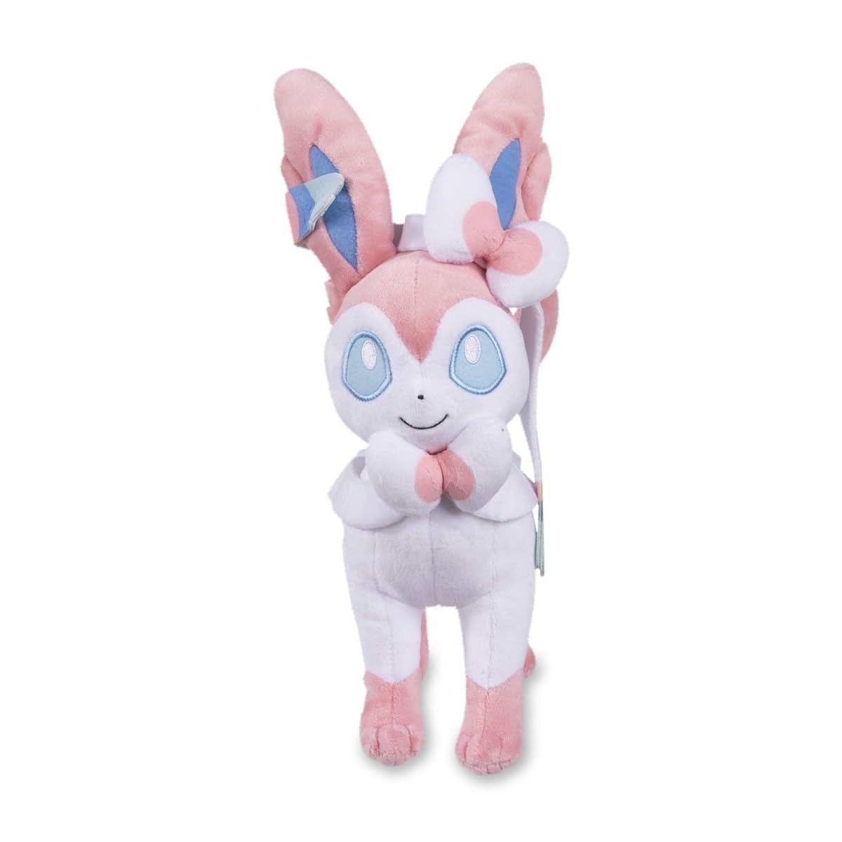 Pokemon Center Sylveon plush side view highlighting blue eyes and plush texture.