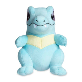 Totodile Poké Plush features felt teeth and zigzag back spikes for a cheerful look.