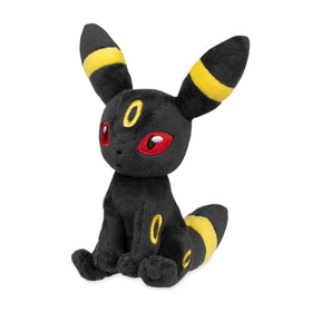Pokemon Center Umbreon Sitting Cuties plush on desk for display.