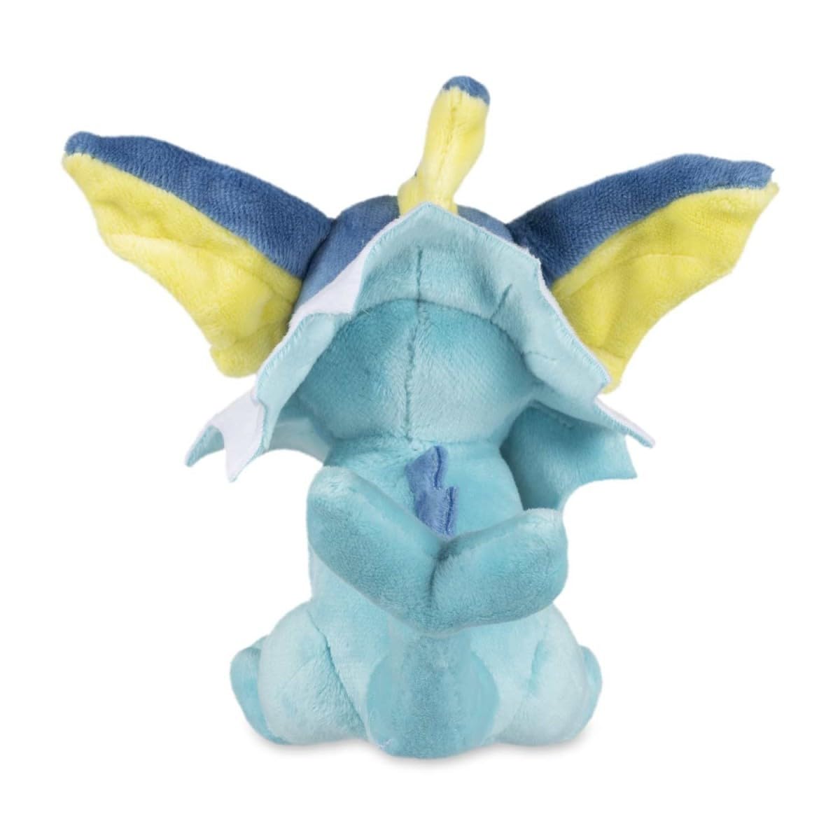 Vaporeon Sitting Cuties Plush on a flat surface, ideal desk buddy.