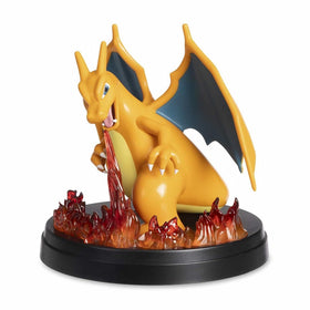 Charizard figure's translucent flames under lighting create a warm display glow