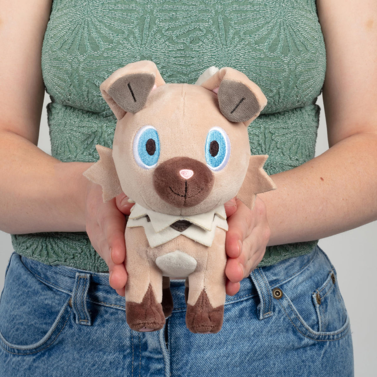 Rockruff plush toy inspired by anime and video games for fans.