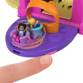 Candy wheel dispenses pretend gumballs with surprises to discover during play.
