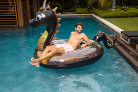PoolCandy giant dragon float ideal for two to three adults lounging.