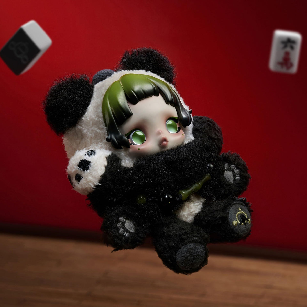 POP MART SkullPanda pendant on a car dashboard, a charming travel companion.