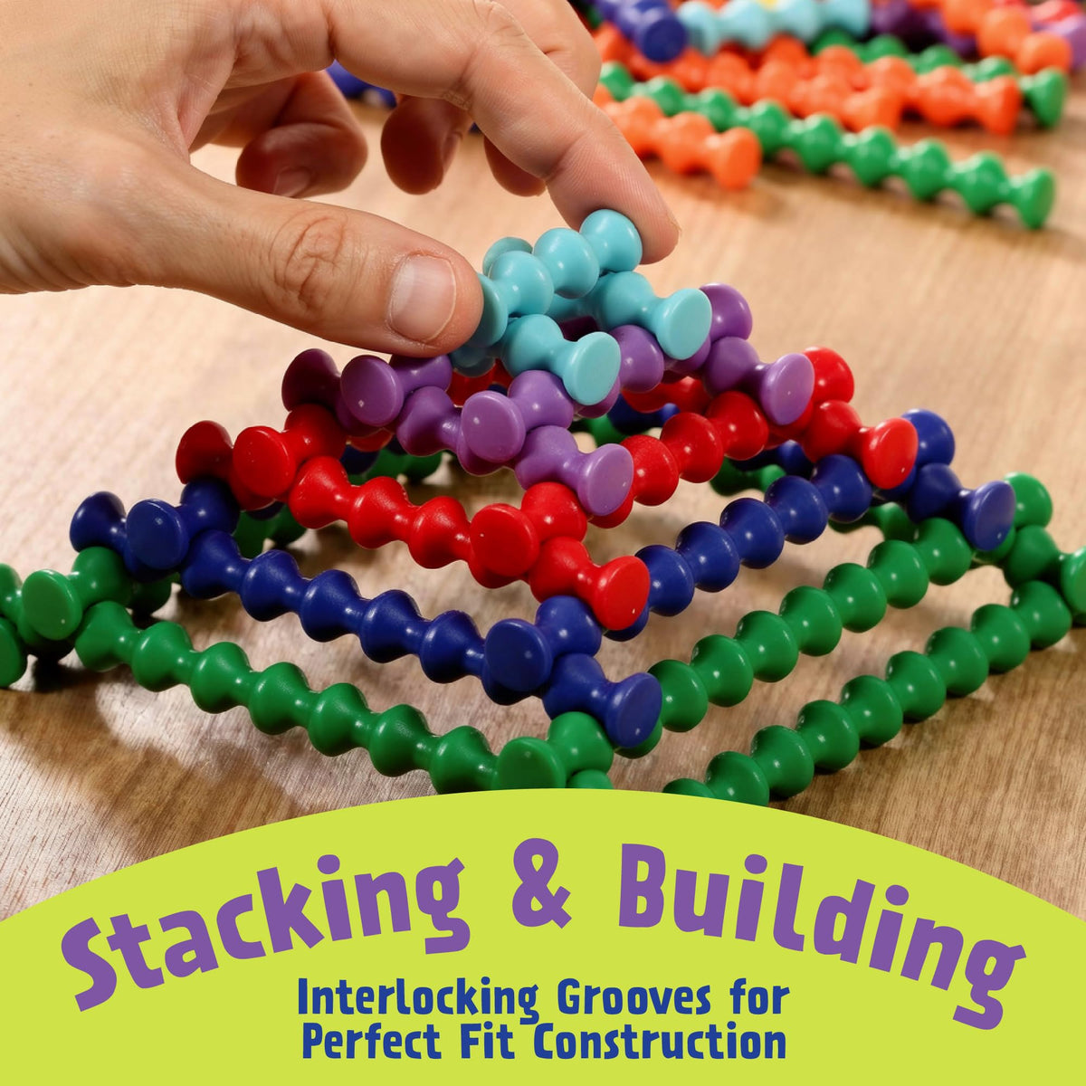 Popular Playthings Playstix color coding guides planning and size comparison during building.